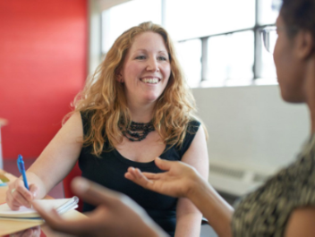 Photo of two people talking