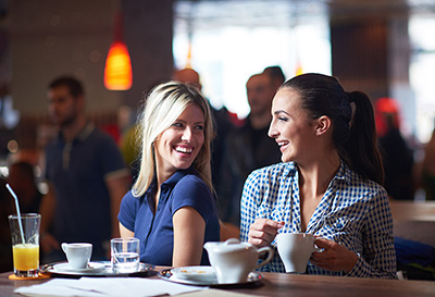 two woman having coffee